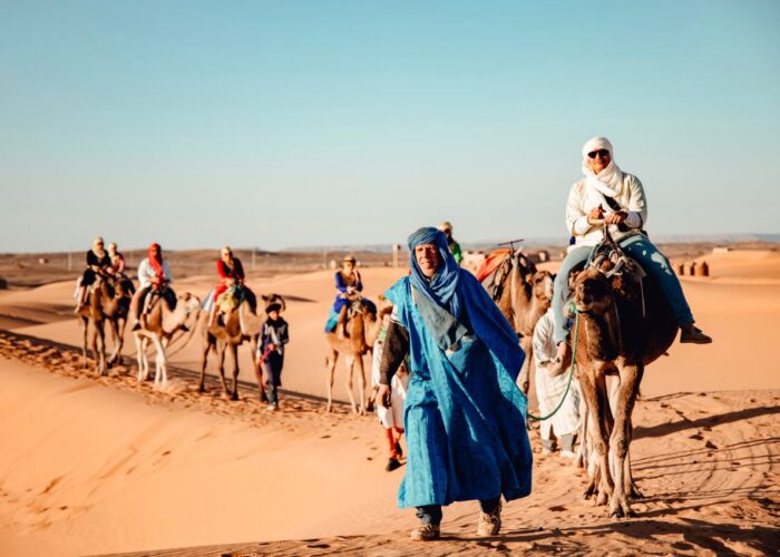 Sand dunes adventure Morocco with sandboarding quad biking and sunset camel trekking