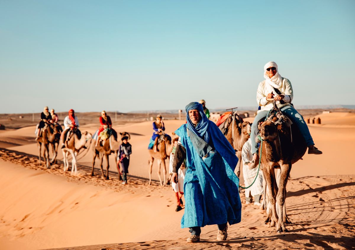 Sand dunes adventure Morocco with sandboarding quad biking and sunset camel trekking